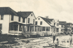 old photograph of homes along a street